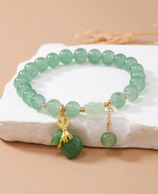 HANDMADE GREEN BRACELET WITH MONEY POTLI LUCKY CHARM